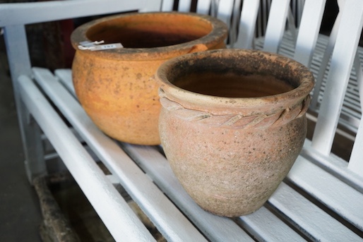 Two circular terracotta garden planters, larger width 38cm, height 23cm